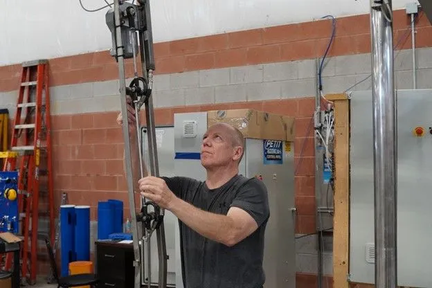 Man inspecting Petit Auto Wash Equipment