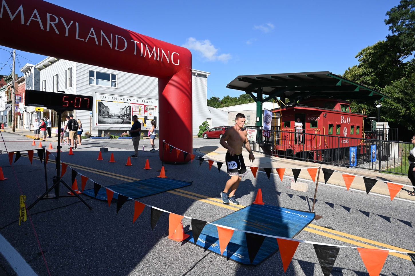 Runner crossing finish line at Maryland Timing event