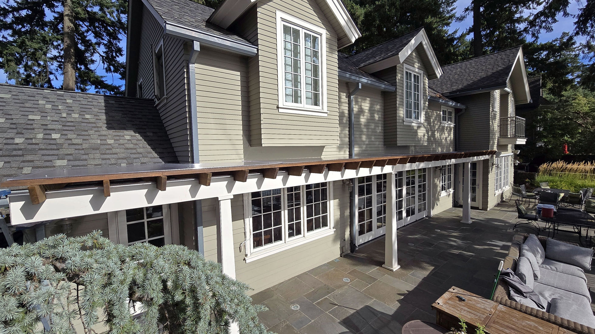 A two-story house painted by Malle Painting.