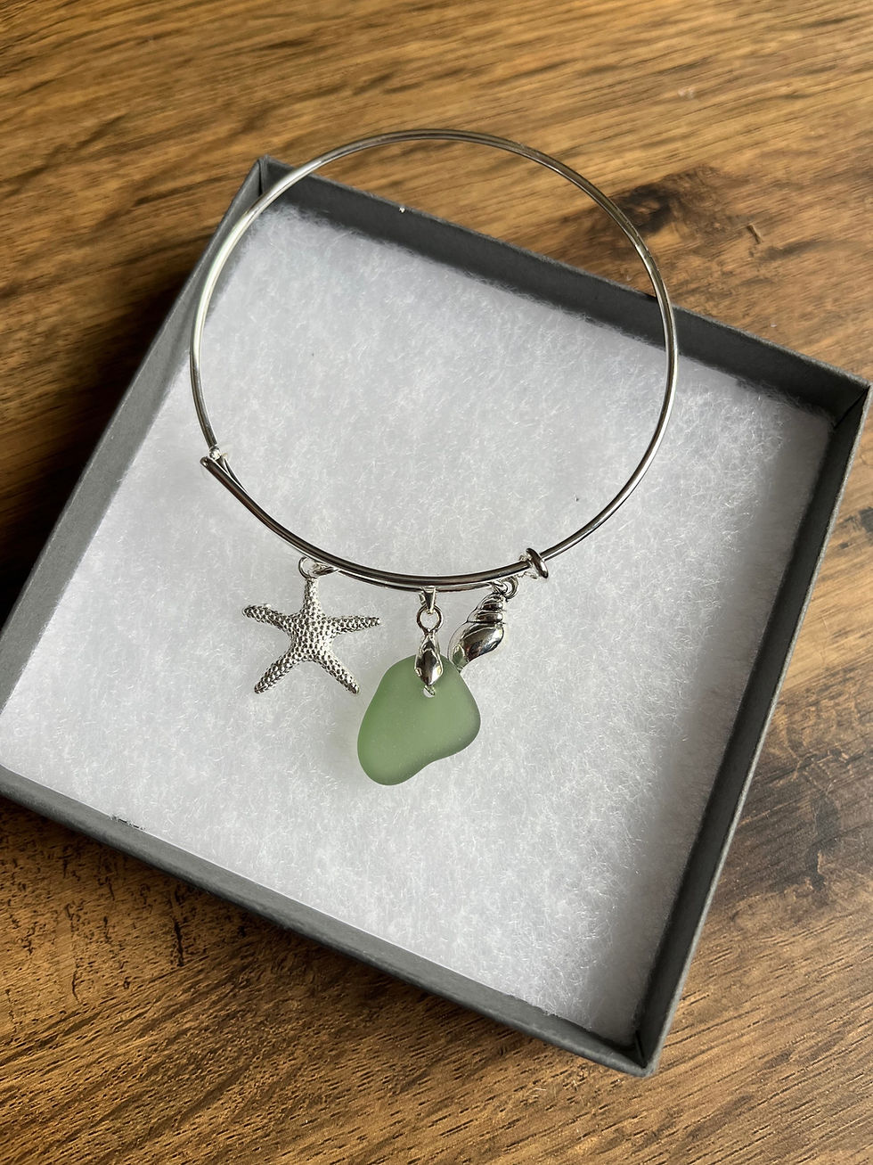 Thumbnail: Cornish Seaglass on Silver plated  bangle with starfish and shell charm 