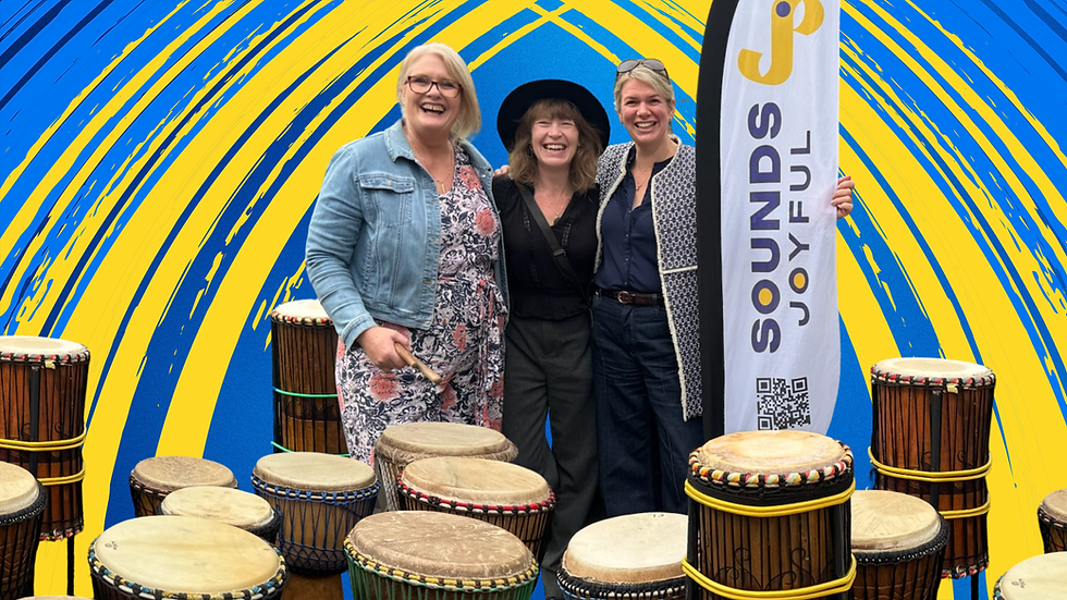 Jo Coomber, Jennie Addis and Emma Wheat surrounded by Djembe Drums