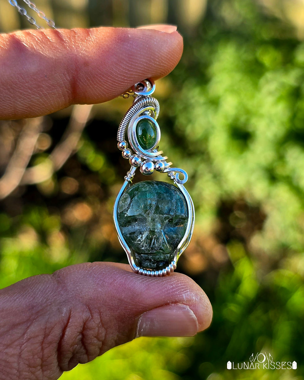 Thumbnail: Green Tourmaline Skull by Leandro Souza • Sterling Silver Wire Wrapped Pendant 