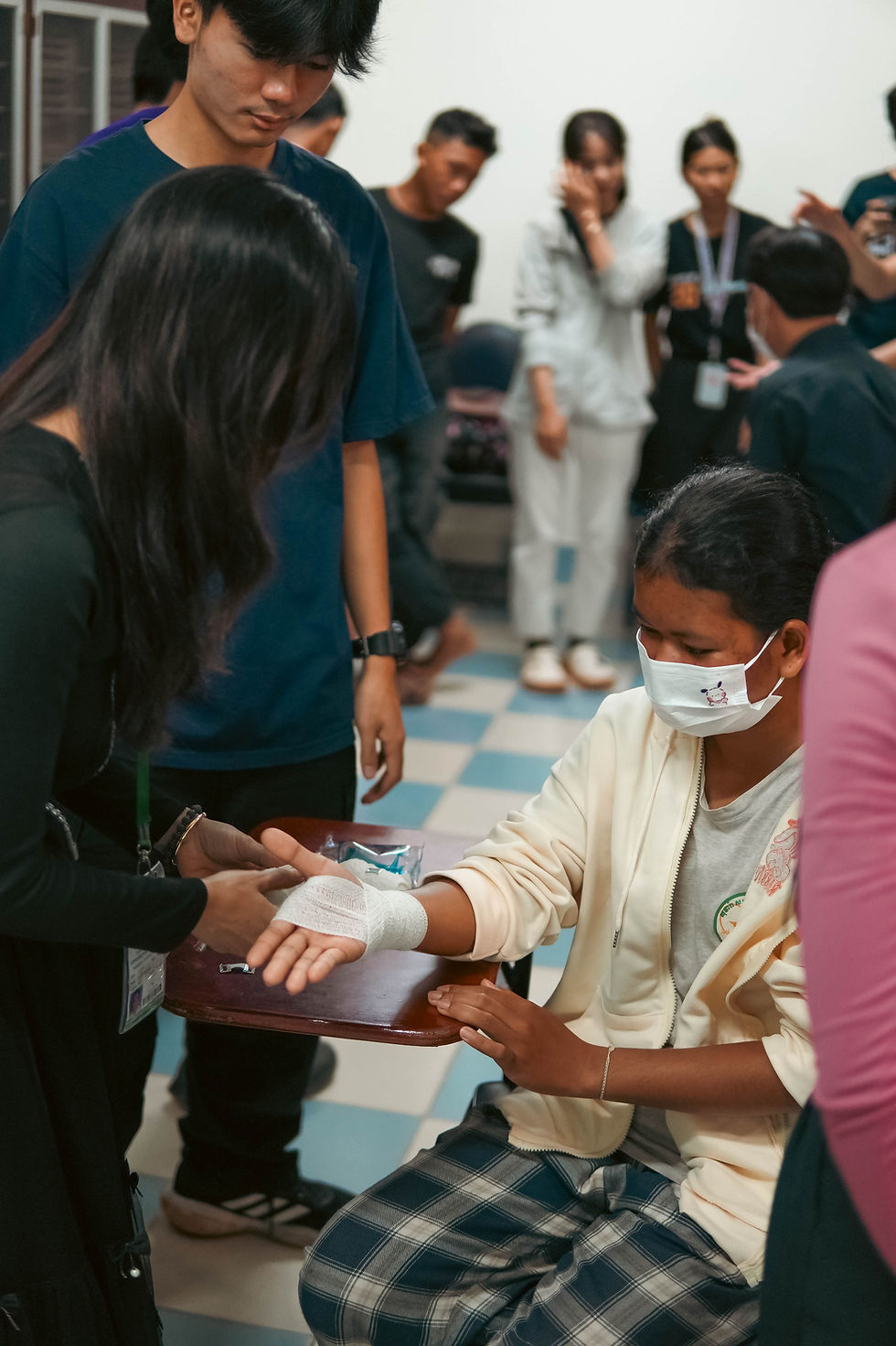 The students trying on each other during the hands-on session.
