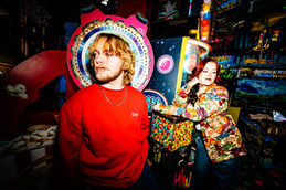 Christina Cook Cooper Ryckman editorial photoshoot portrait photography night arcade couple fashion model fun games creative