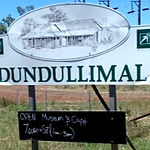 Dundullimal Homestead sign showing an illustration of the front of the house.