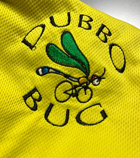 Dubbo BUG logo stitched onto a cycling jersey. Logo is of a dragonfly riding a bicycle.