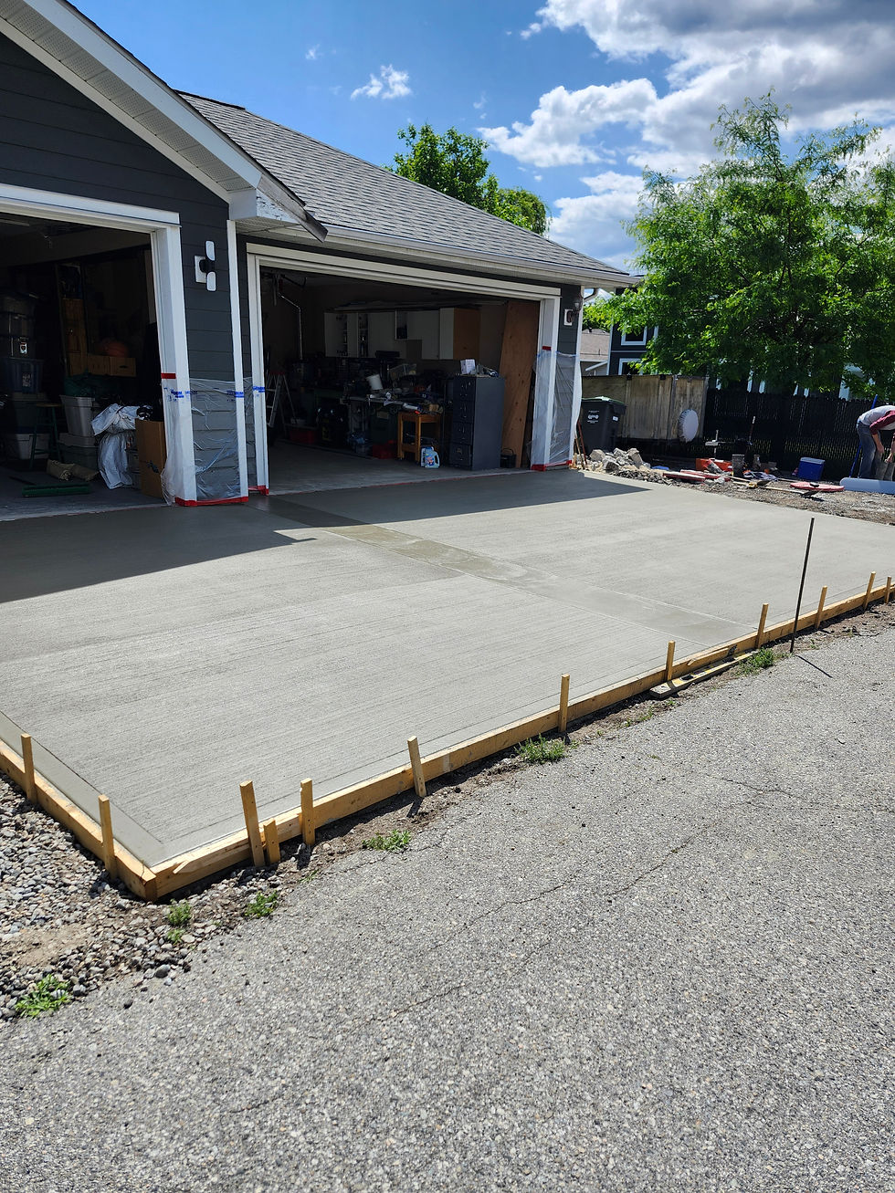 Durable residential concrete driveway designed and installed by ScheerStone Concrete.