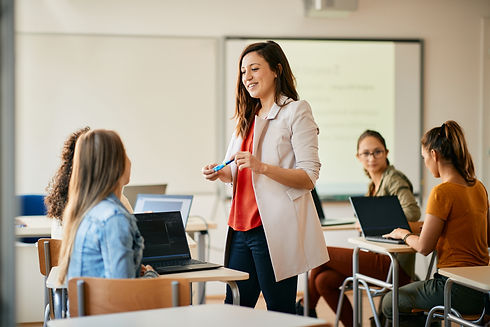 happy-it-teacher-talking-to-her-students-during-co-2022-11-23-18-00-59-utc.jpg
