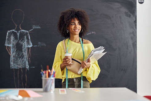 smiling-african-american-teacher-stands-at-table-a-2022-01-19-00-10-08-utc.jpg