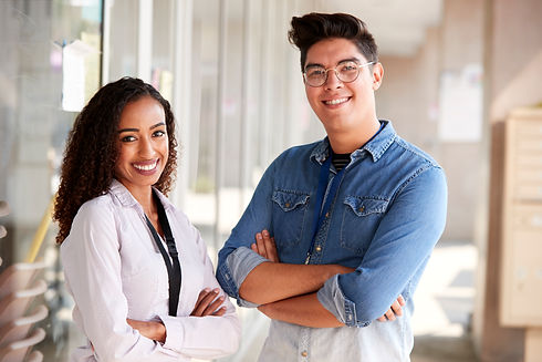 portrait-of-smiling-male-and-female-school-teacher-2021-08-26-16-13-32-utc.jpg