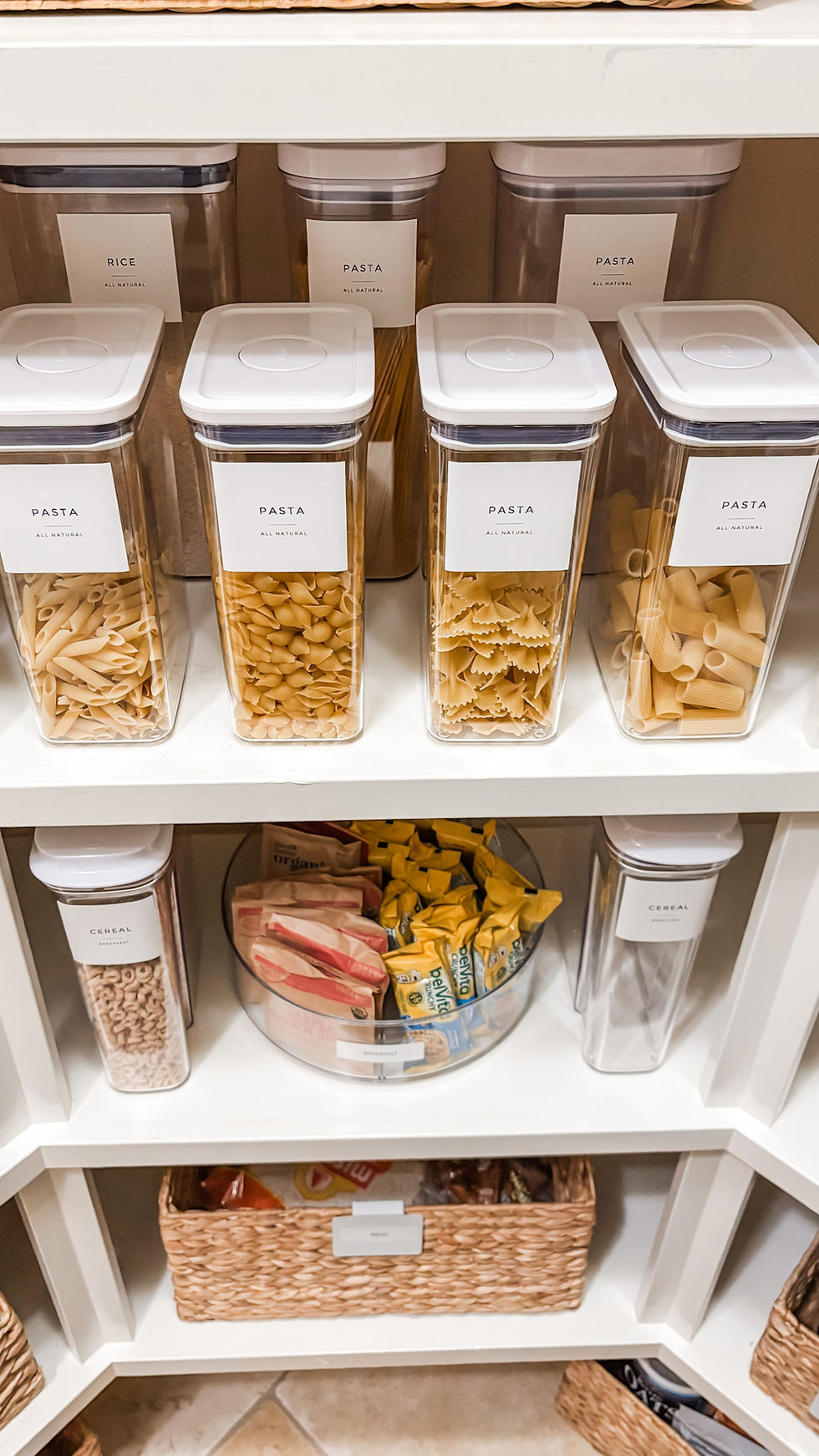 Organized pantry with labeled containers, baskets, and clear zones for everyday food storage