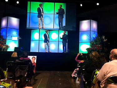 Glenn Thayer, Master of Ceremonies, on stage with Dr. Oz