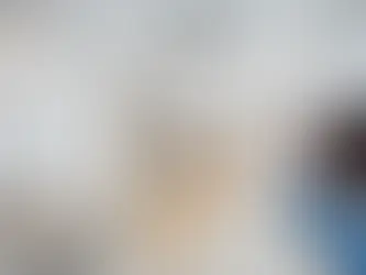 Modern living room with minimalist Scandinavian furniture, neutral color palette, and natural wood accents, reflecting modern interior design style.