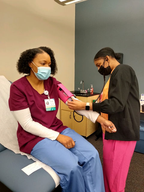 student practicing blood pressure