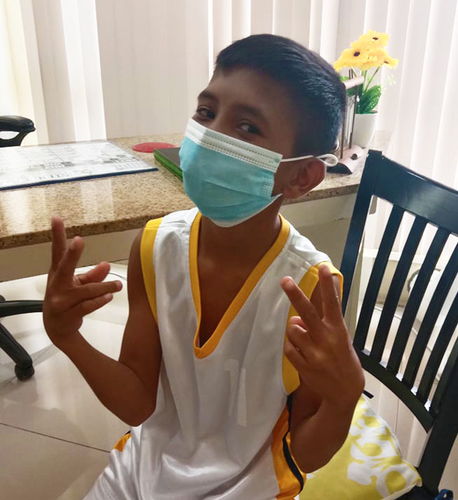 A young boy at the plastic surgeon clinic