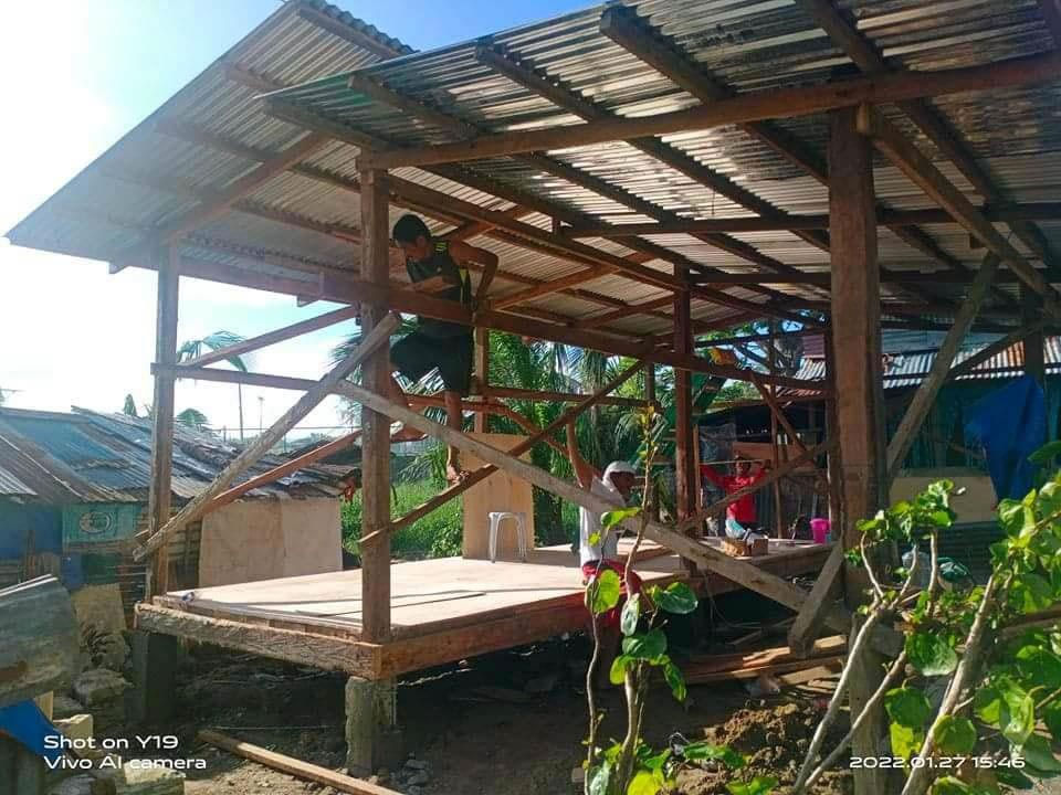 Abounding employee working in a new house for a Filipino family.