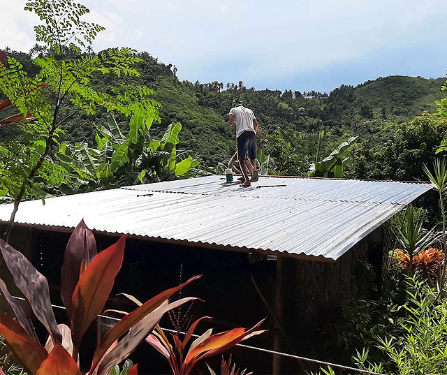 Completed repair of the roof for a Filipino family.