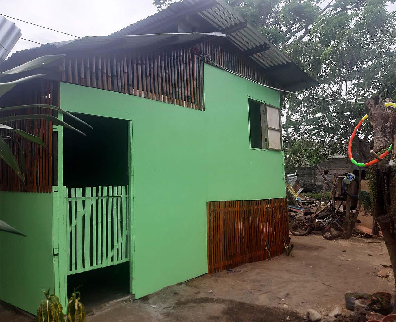 Newly repaired house of a poor Filipino family with the help of a charity.