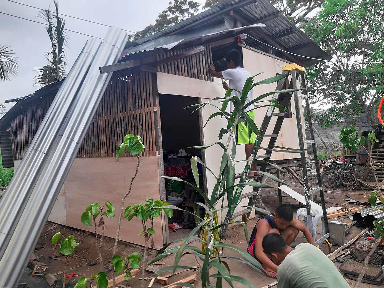 Abounding team works on several home repairs in the Philippines after Typhoon Yolanda.
