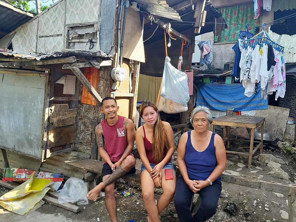 A family in the Philippines whose house was destroyed by Typhoon Odette