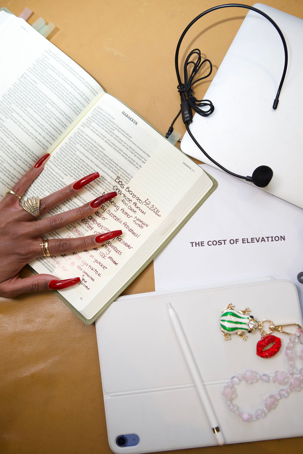 woman hand on bible opened to Habbakuk
