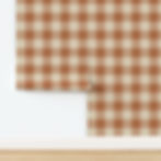 Brown plaid wallpaper with alternating solid and striped squares, partially unrolled against a white wall and wooden floor.
