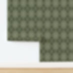 Olive green wallpaper with a diamond pattern partially unrolled against a white wall on a wooden floor. No text visible.