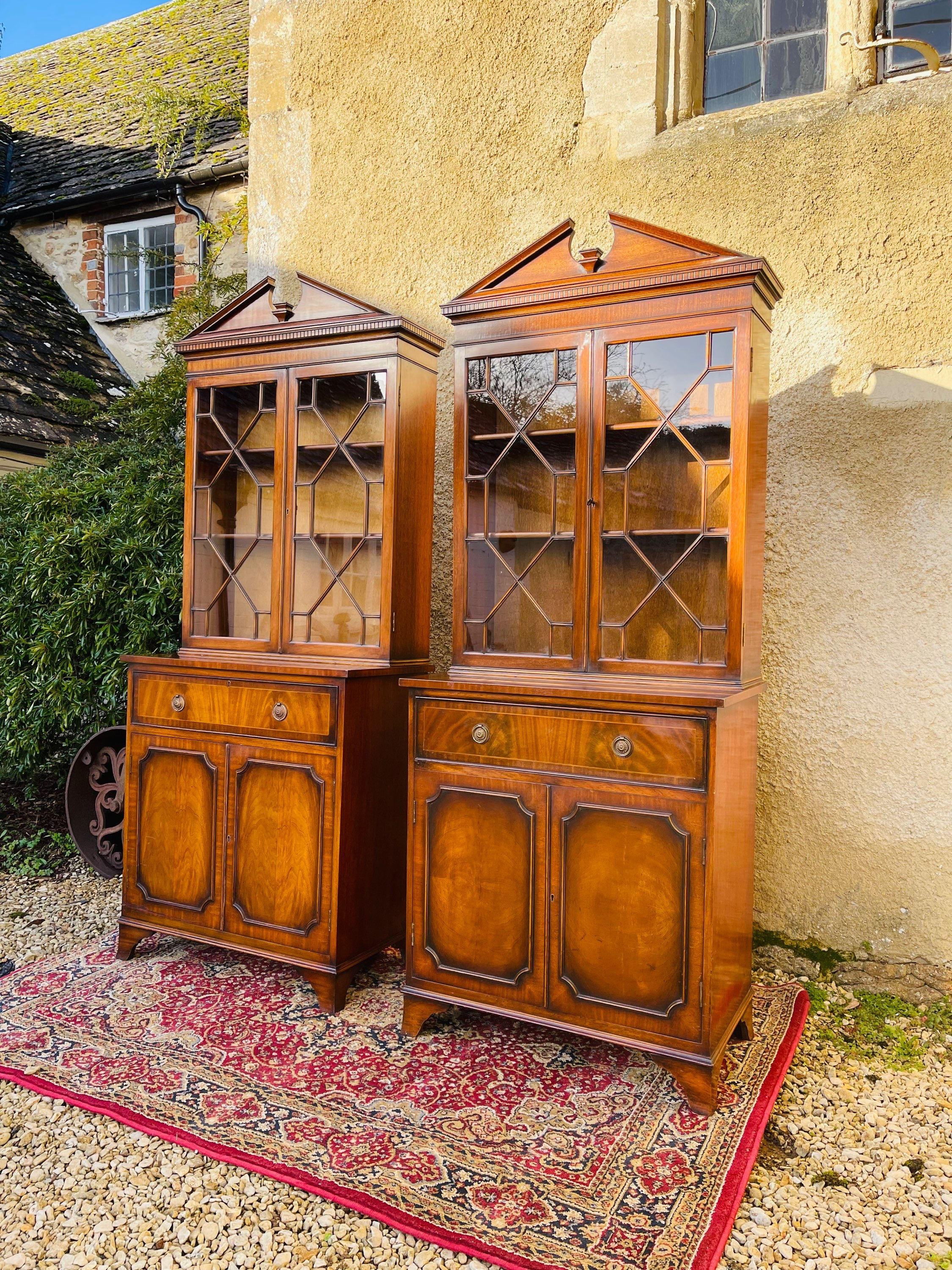 Pair of reproduction mahogany cabinet bookcases of Architectural form - #8180