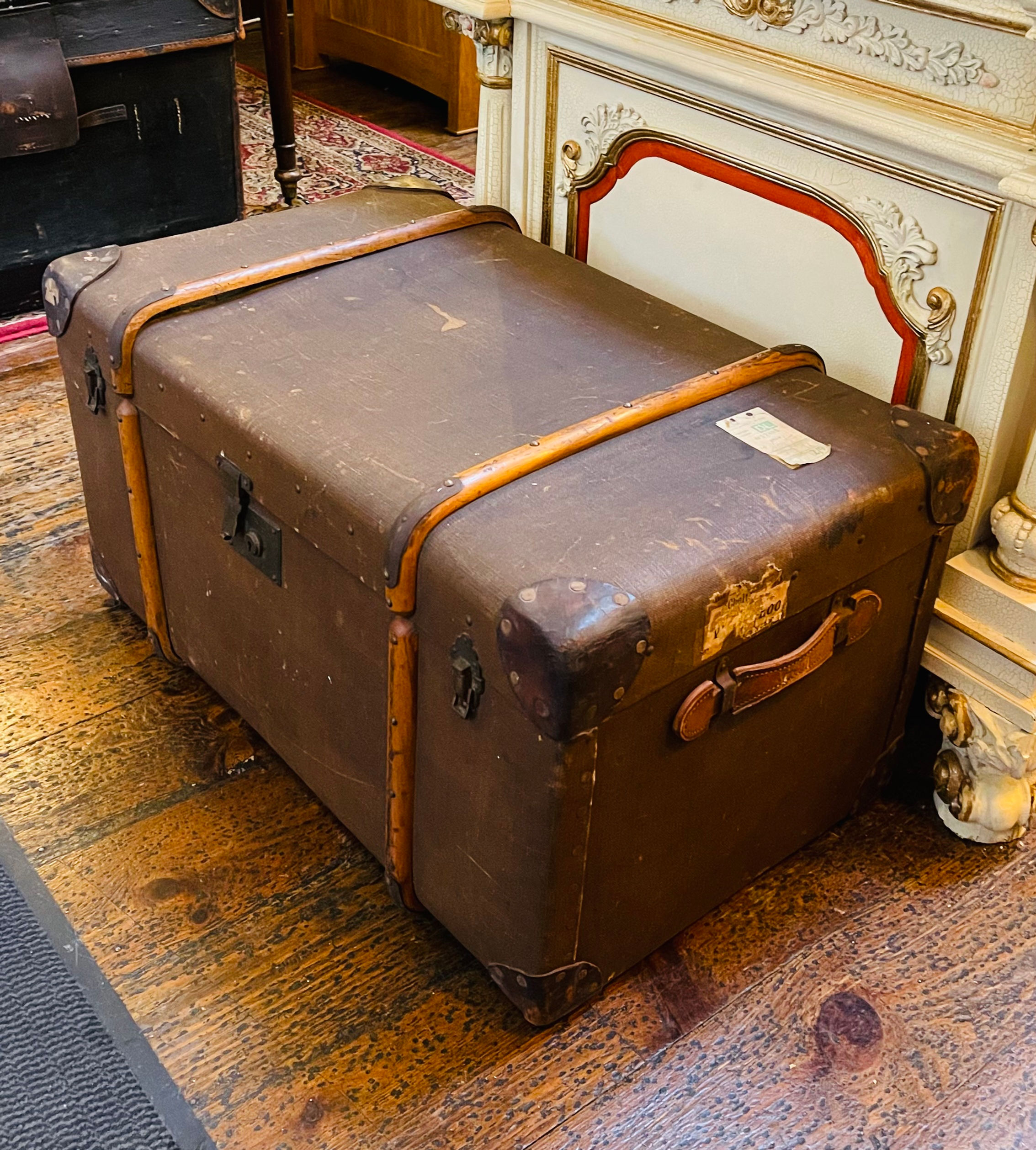 Large antique bent wood banded steamer trunk - dark tan exterior. 