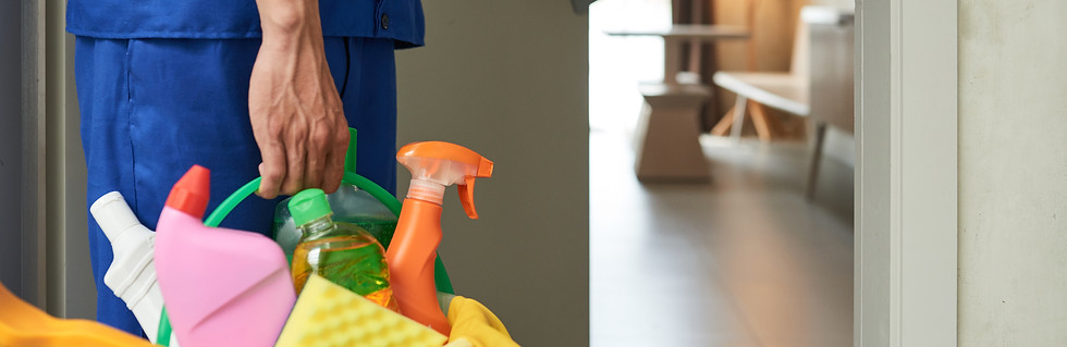 unrecognizable-cleaner-walking-into-hotel-room-with-tools-detergents.jpg
