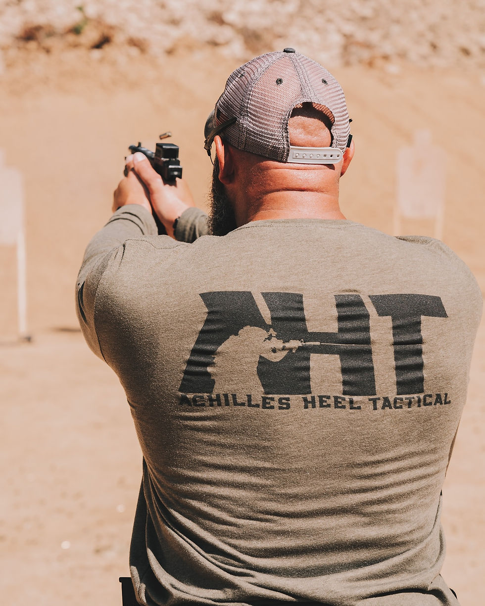 David Acosta taking a longer shot on the range with his defensive pistol.