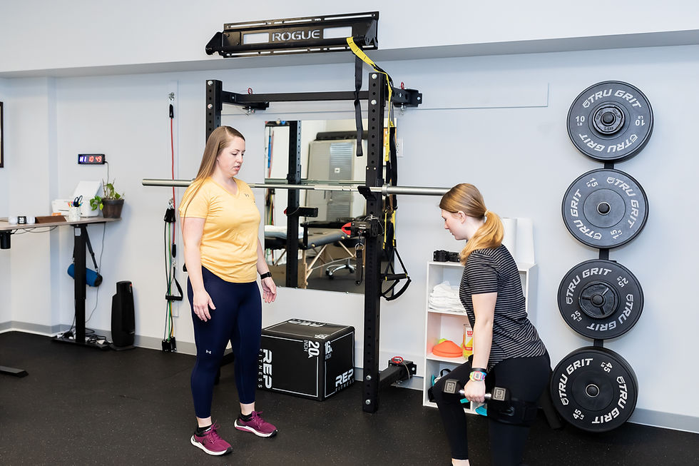 A performance physical therapist trains a teenage female athlete post-op ACL reconstruction.