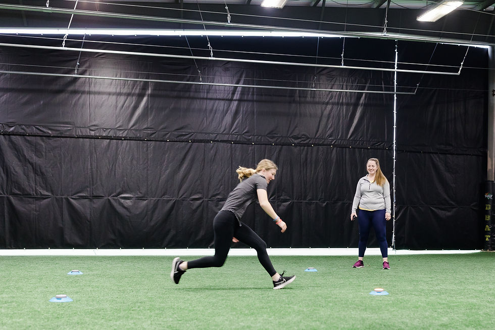 a high school aged softball player athlete training agilities using blazepods with coaching from her sports physical therapist
