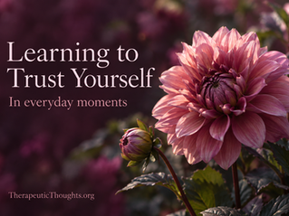 Pink dahlia and bud against plum foliage. Text: “Learning to Trust Yourself. In everyday moments. TherapeuticThoughts.org.”