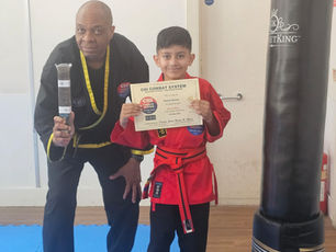 Hassan proudly receives his Brown Belt at Chi Combat System after successfully passing his martial arts grading