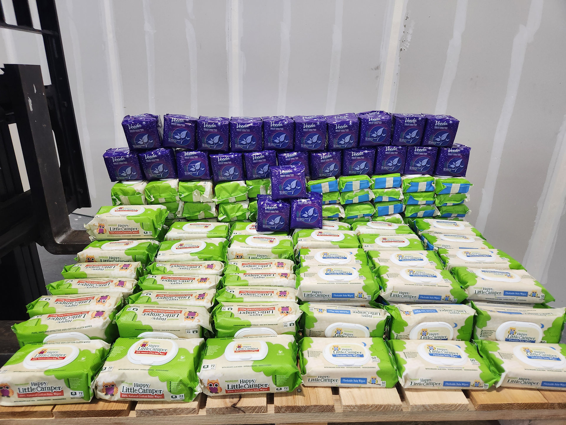 Donation of Happy Little Camper baby Wipes and Veeda Night Pads