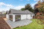 A house we have renovated and extended, showing the rear patio and lawn