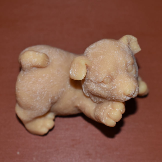 A top view of the playful pup molded soap.