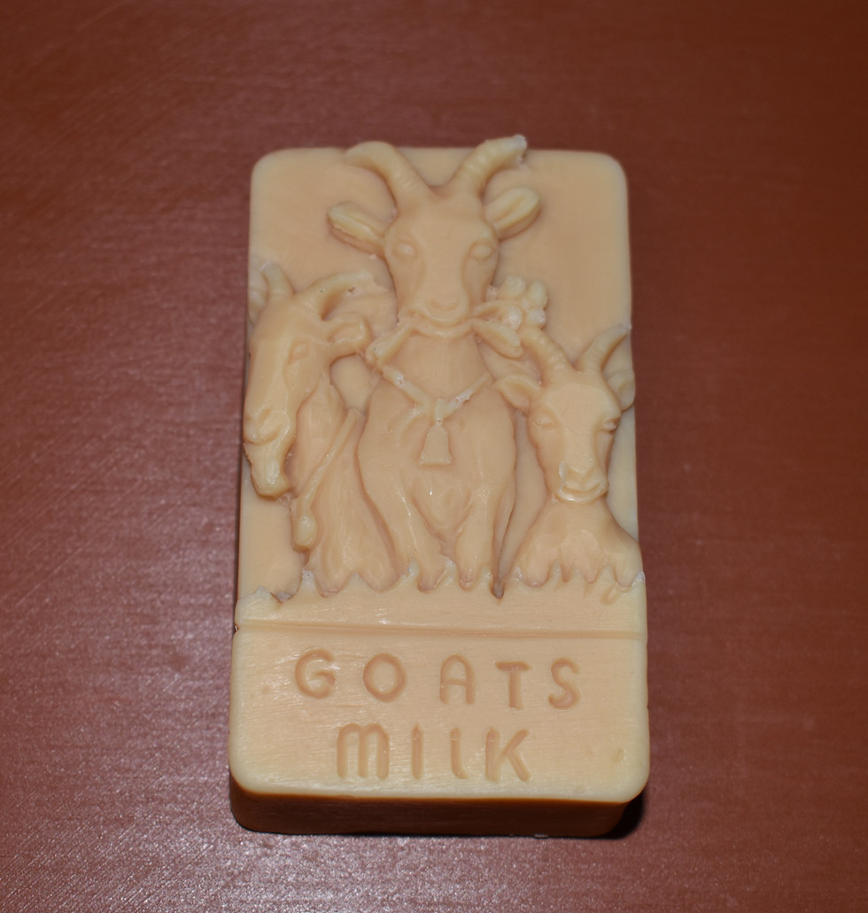 This is a bar of our goat milk soap with three goat horned goats on it.
