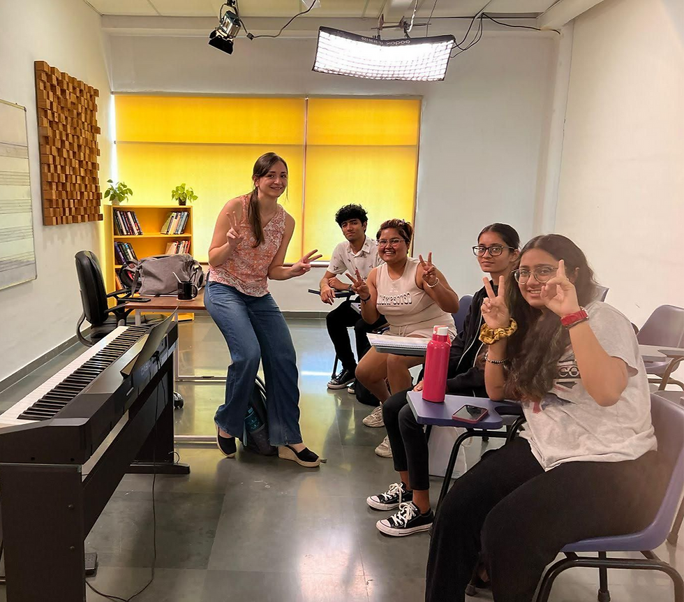 With students teaching piano