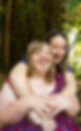 One of our participants and workers having a wonderful time laughing with their arms around each other.