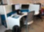 Modern office workspace with laptop and monitors