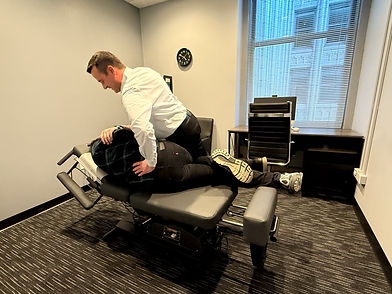 Adjusting Patient Downtown Chicago Chiropractor - Loop Spine & Sports Center