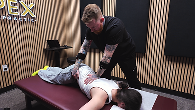 Dallas Chiropractor Dr. Strat Poulson Adjusting Patient