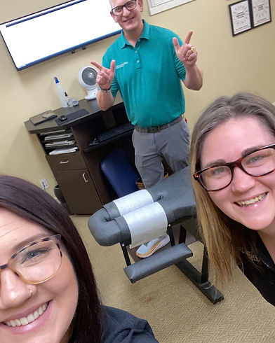 chiropractic wellness center staff smiling chiropractor tulsa ok.jpeg