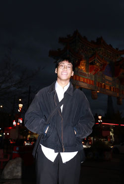 Man smiling in front of Chinatown