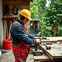 SHOWING SOME TOOLS WITH A WORKER IN THE 