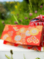 kimono fabric wallet surrounded by wildflowers
