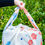 Thumbnail: Japanese Apricot furoshiki bag being carried in a field