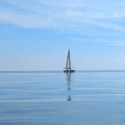 a yacht on a calm sea in Cornwall
